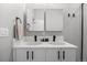 Modern bathroom showcasing a double vanity with a unique design at 3820 Jason St # 3, Denver, CO 80211
