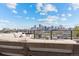 Stunning city views from the rooftop deck with comfortable seating area, perfect for outdoor relaxation and entertainment at 3820 Jason St # 3, Denver, CO 80211