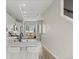 A modern kitchen with stainless steel appliances flows into the dining area at 3820 Jason St # 3, Denver, CO 80211