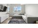 Bright living room with a sectional couch and designer rug at 3820 Jason St # 3, Denver, CO 80211