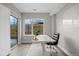 Well-lit home office with a large window, modern desk, and access to a patio for a refreshing work environment at 3820 Jason St # 3, Denver, CO 80211
