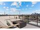 Inviting rooftop deck featuring comfortable seating and a cozy fire pit at 3820 Jason St # 3, Denver, CO 80211