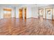 Finished basement showcasing hardwood floors, wood trim, multiple doorways, and ample open space at 11766 Coal Creek Heights Dr, Golden, CO 80403