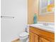 Simple bathroom with a wood vanity and a towel rack at 11766 Coal Creek Heights Dr, Golden, CO 80403
