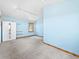 Spacious bedroom with light blue walls, carpet flooring, track lighting, and a wardrobe with mirrored doors at 11766 Coal Creek Heights Dr, Golden, CO 80403