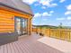 Outdoor deck with a log railing and beautiful mountain and valley views at 11766 Coal Creek Heights Dr, Golden, CO 80403