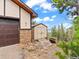 Exterior shot featuring a storage shed, hot tub, and partial views of the garage and mountains at 11766 Coal Creek Heights Dr, Golden, CO 80403