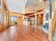 Living room with wood floors and beams with views of the upper level at 11766 Coal Creek Heights Dr, Golden, CO 80403