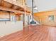 Living area featuring a wood-burning stove, a second-story loft, and an open floor plan at 11766 Coal Creek Heights Dr, Golden, CO 80403