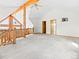 Open concept living space featuring exposed beams, vaulted ceilings, and picturesque views of the outdoors at 11766 Coal Creek Heights Dr, Golden, CO 80403