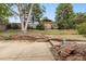 Backyard featuring a patio, tiered landscaping, a rock garden, and a wooden fence at 18625 E Kent Dr, Aurora, CO 80013