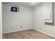 Basement with cozy carpet, a small window, and clean white walls at 18625 E Kent Dr, Aurora, CO 80013