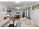 Bright living room with elegant furnishings, hardwood floors, and decorative lighting fixtures at 18625 E Kent Dr, Aurora, CO 80013
