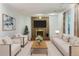 Elegant living room with brick fireplace, large windows, and comfortable seating at 18625 E Kent Dr, Aurora, CO 80013