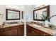 Luxurious bathroom with dual vanities, framed mirrors, granite countertops, and stylish fixtures at 5265 S Cathay Way, Centennial, CO 80015