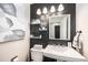 Cozy bathroom with modern fixtures, dark accent wall, and decorative elements at 5265 S Cathay Way, Centennial, CO 80015