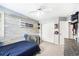 Bright bedroom featuring modern decor, closet, and natural light at 5265 S Cathay Way, Centennial, CO 80015