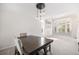 Dining room featuring contemporary lighting fixture, large table, and bay window at 5265 S Cathay Way, Centennial, CO 80015