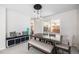 Bright dining area showcasing stylish furniture, storage bench, and backyard view at 5265 S Cathay Way, Centennial, CO 80015