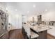 Beautiful kitchen with granite countertops, stainless steel appliances, and an island with barstool seating at 5265 S Cathay Way, Centennial, CO 80015