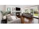 Comfortable living room with a fireplace, built-in shelving, and sliding glass doors to the backyard at 5265 S Cathay Way, Centennial, CO 80015