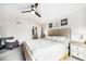 Spacious main bedroom with neutral tones, plush carpet, and a cozy armchair at 5265 S Cathay Way, Centennial, CO 80015