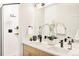 Stylish bathroom with a double sink vanity, modern fixtures, and glass-enclosed shower at 2105 S Galapago St # 4, Denver, CO 80223