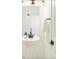 Modern powder room featuring a sleek pedestal sink and stylish black fixtures at 2105 S Galapago St # 4, Denver, CO 80223