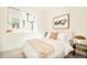 Serene bedroom featuring a plush bed, contemporary decor, and ample natural light at 2105 S Galapago St # 4, Denver, CO 80223