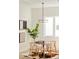 Cozy dining area featuring a round table, modern chandelier, and stylish decor at 2105 S Galapago St # 4, Denver, CO 80223