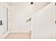 Bright entryway featuring a staircase, tiled flooring, and a contemporary light fixture at 2105 S Galapago St # 4, Denver, CO 80223