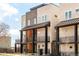 Modern townhome exterior with striking architecture, private balconies, and contemporary design elements at 2105 S Galapago St # 4, Denver, CO 80223