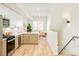 Modern kitchen featuring stainless steel appliances, light wood cabinets, and an island at 2105 S Galapago St # 4, Denver, CO 80223