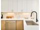 Bright kitchen features quartz counters, sleek cabinetry, and modern appliances at 2105 S Galapago St # 4, Denver, CO 80223