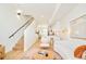 Open floorplan showcases living space with modern staircase and kitchen view at 2105 S Galapago St # 4, Denver, CO 80223