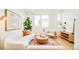 Cozy living room with large windows, stylish furniture, and contemporary decor at 2105 S Galapago St # 4, Denver, CO 80223