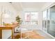 Bright home office with natural light, desk, and a sliding door to a balcony at 2105 S Galapago St # 4, Denver, CO 80223
