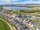 Aerial view of property showcasing the neighborhood and lake at 3214 Heron Lakes Pkwy, Berthoud, CO 80513