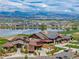 Stunning clubhouse with scenic mountain views overlooking the golf course and tranquil lake at 3214 Heron Lakes Pkwy, Berthoud, CO 80513