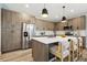 Modern kitchen boasts stainless steel appliances, a large island, and stylish pendant lighting at 4127 Tejon St, Denver, CO 80211