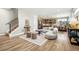 Inviting living room with stairs, open kitchen, and stylish furnishings with plenty of light at 4127 Tejon St, Denver, CO 80211