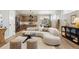 Comfortable living room with modern curved sofa, kitchen view, and stylish decor at 4127 Tejon St, Denver, CO 80211
