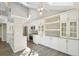 Modern kitchen featuring white cabinetry, stainless steel appliances, pendant lights, and skylights at 9455 W 81St Ave # A, Arvada, CO 80005