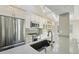 Kitchen featuring stainless steel appliances, quartz countertop, and ample storage at 9455 W 81St Ave # A, Arvada, CO 80005