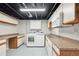 Well-equipped laundry room with modern appliances, countertop space, and storage cabinets at 9455 W 81St Ave # A, Arvada, CO 80005