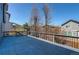A spacious back deck provides an outdoor living space with views of the neighborhood and blue sky at 10486 Cheetah Winds, Lone Tree, CO 80124