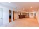Spacious finished basement featuring an open layout with a wet bar and recessed lighting at 10486 Cheetah Winds, Lone Tree, CO 80124