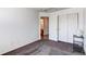 Bedroom view featuring a closet with double doors, neutral colors, and patterned carpet flooring at 10486 Cheetah Winds, Lone Tree, CO 80124