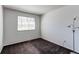 Cozy bedroom with natural light, a window with blinds, and patterned carpet flooring at 10486 Cheetah Winds, Lone Tree, CO 80124