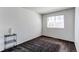 Bright bedroom with neutral colors, a window, and patterned carpet flooring at 10486 Cheetah Winds, Lone Tree, CO 80124